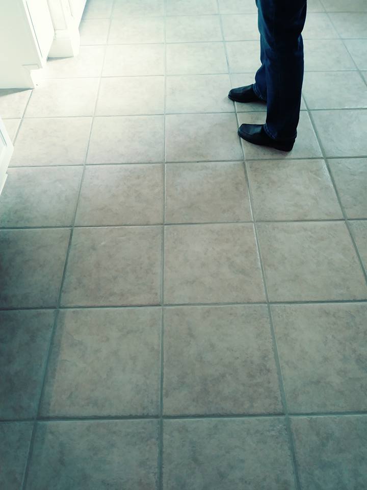 A person standing on the floor of a room.
