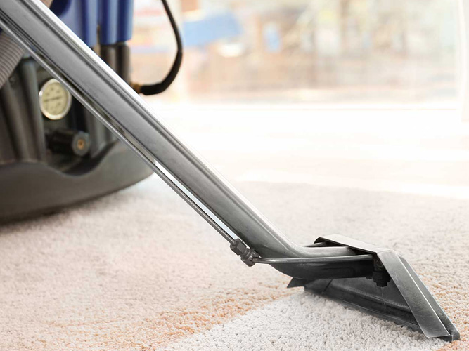 A close up of a vacuum cleaner on the floor
