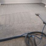 A carpet cleaning machine is being used to clean the floor.
