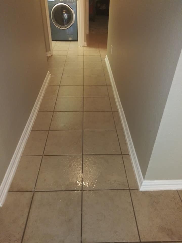 A hallway with tile floors and walls.