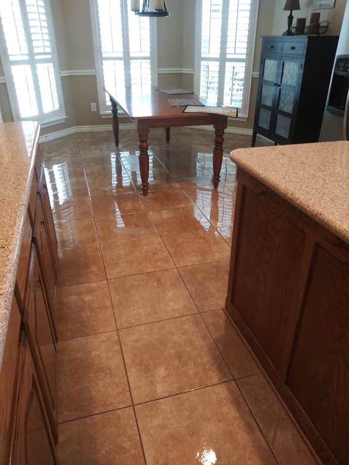 A kitchen with tile floors and granite counter tops.
